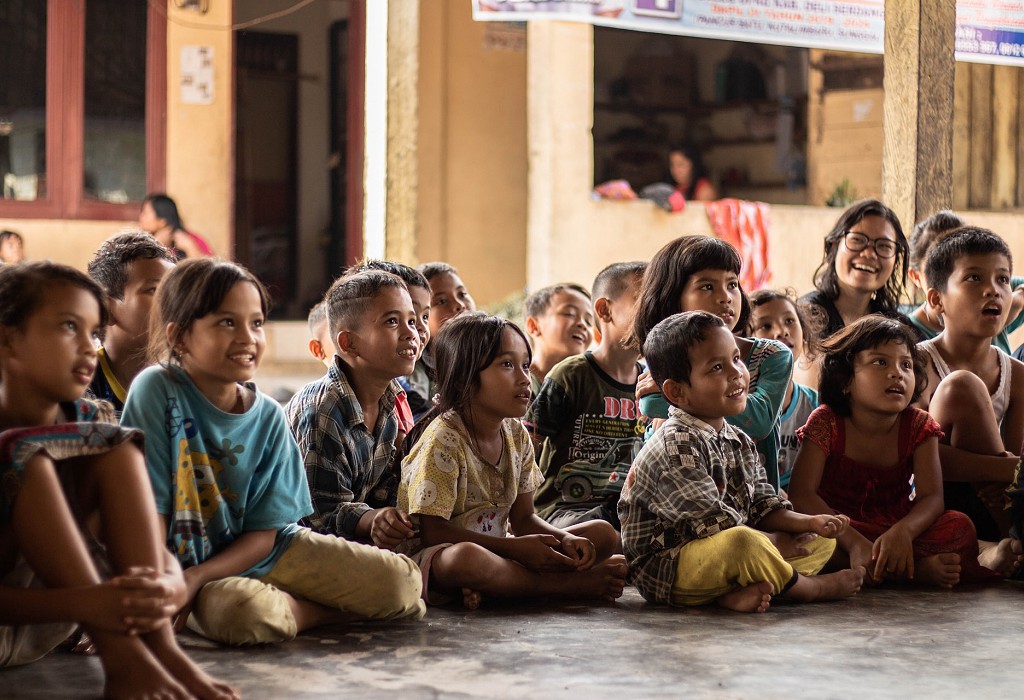 School kids sitting down