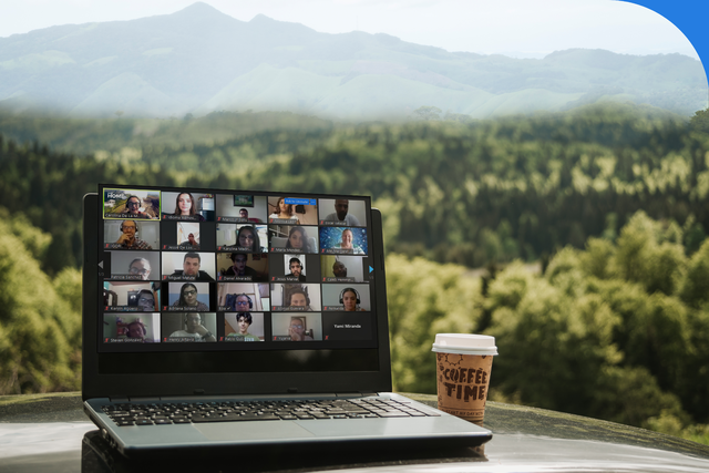 coffee cup next to laptop